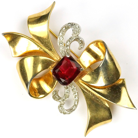 Mazer Pave and Ruby Swirling Golden Bow Pin